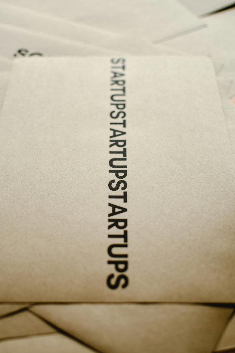 Close-up of startup concept text on brown paper emphasizing entrepreneurship and innovation.